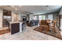 Open concept living space with tile floors, with view of kitchen, dining, and Gathering area at 5854 Olivine Falls Ave, Las Vegas, NV 89130