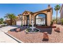 Charming two-story home featuring a three-car garage and inviting front yard with decorative fountain at 6 High Sierra Dr, Henderson, NV 89074