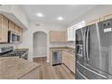 Well-equipped kitchen with stainless steel appliances and light wood cabinets, offering a functional and stylish space at 6480 Annie Oakley Dr # 112, Las Vegas, NV 89120