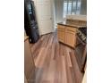 Open kitchen features a refrigerator, range and granite countertops at 6480 Annie Oakley Dr # 112, Las Vegas, NV 89120