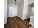 Bright entryway features new floors, fresh paint, and double entry doors at 8010 Coffee Tree Ct, Las Vegas, NV 89123