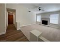 Spacious living room featuring a fireplace and lots of natural light at 8010 Coffee Tree Ct, Las Vegas, NV 89123