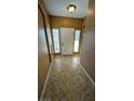Inviting foyer with tile flooring, natural light, and neutral wall color at 8159 Base Camp Ave, Las Vegas, NV 89178