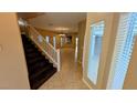 Inviting entryway with tiled floors and staircase leading to the upper level at 8159 Base Camp Ave, Las Vegas, NV 89178