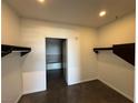 Walk-in closet features shelving and leads to a bathroom with a soaking tub at 900 Las Vegas Blvd # 1003, Las Vegas, NV 89101