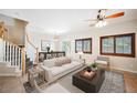 Bright living room with modern furnishings and stylish decor, seamlessly flowing to dining area at 9490 Thunder Sky St # 102, Las Vegas, NV 89178