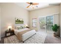 Serene main bedroom boasting private balcony access and neutral tones, creating a relaxing retreat at 9490 Thunder Sky St # 102, Las Vegas, NV 89178