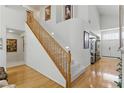 Spacious foyer with wood floors, a grand staircase, and high ceilings for an elegant entrance at 9785 Turtle Head Ct, Las Vegas, NV 89117