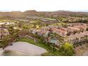 Stunning aerial view showcasing the community's well-manicured lawns, pool, landscaping, and Mediterranean-style architecture at 11 Via Vita Bella, Henderson, NV 89011