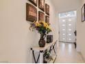 Elegant home hallway with stylish decor and bright, welcoming atmosphere, and white paneled doors at 130 W Fairway Rd, Henderson, NV 89015