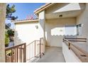 Private entryway to home features stucco walls, terracotta tiled roof, and secure front door at 1405 S Nellis Blvd # 2117, Las Vegas, NV 89104
