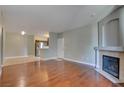 Spacious living room features hardwood floors, neutral walls, and a fireplace at 1405 S Nellis Blvd # 2117, Las Vegas, NV 89104