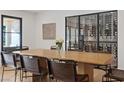 Elegant dining room with wine storage, featuring a large table perfect for Gathering gatherings at 204 Canyon Dr, Las Vegas, NV 89107