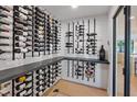 Custom wine cellar featuring an extensive collection, granite countertop, and stylish wall-mounted racks at 204 Canyon Dr, Las Vegas, NV 89107