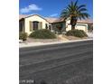 Well-maintained single-story home with a two-car garage and drought-tolerant landscaping at 2175 Clearwater Lake Dr, Henderson, NV 89044