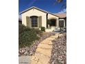 Inviting home entrance with a decorative stone walkway and iron gate at 2175 Clearwater Lake Dr, Henderson, NV 89044