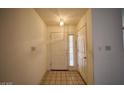 Entryway with neutral tile flooring, a white front door with sidelight, and a coat closet at 2851 S Valley View Blvd # 1199, Las Vegas, NV 89102
