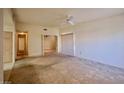 Spacious living room with carpeted floors, ceiling fan, and sliding door closet at 2851 S Valley View Blvd # 1199, Las Vegas, NV 89102