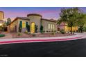 Charming single-story home with a well-manicured front yard and unique architectural details at 2921 Guillemot Ave, North Las Vegas, NV 89084
