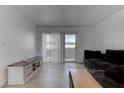 Bright living room featuring modern furniture and a sliding glass door at 3103 Key Largo Dr # 103, Las Vegas, NV 89120