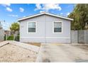A charming house featuring a well-kept yard and a convenient driveway for easy parking at 320 W Van Buren Ave, Las Vegas, NV 89106