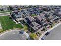 Aerial view of residential neighborhood with well-maintained lawns, paved roads, and modern home architecture at 4376 Latitude Valley Ct, North Las Vegas, NV 89084