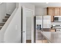 The modern kitchen features stainless steel appliances, a pantry, and countertop island at 439 Royal Bridge Dr, Las Vegas, NV 89178