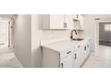 Beautiful kitchen offers white cabinetry and quartz countertops at 4558 Sheppard Dr, Las Vegas, NV 89122