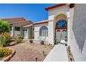 Charming two-story home with a well-manicured lawn and a two-car garage, offering great curb appeal at 4615 Stearman Dr, North Las Vegas, NV 89031