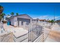 Property featuring a spacious two-car garage, block wall and secure front gate access at 4742 Monterrey Ave, Las Vegas, NV 89121