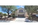 Charming two-story home features a well-manicured front yard and a convenient two-car garage at 4821 Whisper Lake Ave, Las Vegas, NV 89131