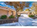 Charming single-story home features a tiled roof, two-car garage, and mature landscaping at 4911 Mount Pleasant Ln, Las Vegas, NV 89113