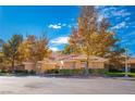 Attractive single-story home featuring mature trees and a terracotta tiled roof at 4911 Mount Pleasant Ln, Las Vegas, NV 89113