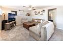 Inviting living room with comfortable seating, decorative shelves, and modern entertainment setup at 5505 Reiter Ave, Las Vegas, NV 89108