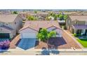An aerial shot of the home, showing roof, desert landscaping, and surrounding neighborhood at 5653 Artesia Lake Ct, Las Vegas, NV 89118