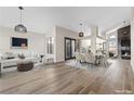Spacious living room with fireplace, wood floors, and ample seating, perfect for relaxation and entertaining at 7221 W Washington Ave, Las Vegas, NV 89128