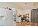 Bright eat-in kitchen area with tile floors and white appliances; perfect for a casual meal at 728 Twilight Blue Ave, North Las Vegas, NV 89032