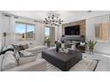 Comfortable living room boasting a modern fireplace, large TV, and a spacious seating area with stylish decor at 7977 Texas Hills St, Las Vegas, NV 89113