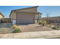 A cozy single-Gathering home with a brick driveway and meticulously manicured desert landscaping at 9698 Pacific Pine St, Las Vegas, NV 89143