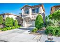 Attractive two-story home boasting a two-car garage, landscaped front yard, and welcoming curb appeal at 10749 Turquoise Valley Dr, Las Vegas, NV 89144