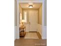 Inviting entryway featuring a front door and tiled floor at 1921 Moonlight Bluff Ave, North Las Vegas, NV 89084