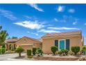 Attractive single-story home featuring a well-kept yard and an attached two-car garage at 2365 Wisconsin Dells Dr, Henderson, NV 89044