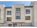 Contemporary townhome showcasing a multi-level facade with private balconies and modern architectural details at 2507 Silent View Ave, Henderson, NV 89044