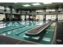 Indoor swimming pool with clear, lane-marked water and a spacious, light-filled environment at 2537 Terrytown Ave, Henderson, NV 89052