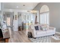 Bright living room with vaulted ceilings, plantation shutters, and wood-look flooring at 2549 Sundew Ave, Henderson, NV 89052