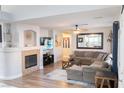 Cozy living area with a fireplace and a large sectional sofa for comfortable lounging at 2549 Sundew Ave, Henderson, NV 89052