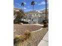 Gated community pool with nearby landscaping at 3150 Soft Breezes Dr # 1033, Las Vegas, NV 89128