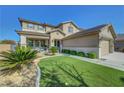 Charming two-story home featuring a three-car garage, neutral paint scheme and a front lawn at 3632 Red Fir St, Las Vegas, NV 89135