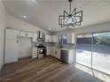 Newly remodeled kitchen boasts modern stainless steel appliances and bright white cabinets at 3920 Aspencrest Dr, Las Vegas, NV 89108