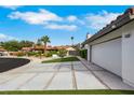 This house boasts a red tile roof, desert landscaping, and an attached two car garage at 4143 Chela Cir, Las Vegas, NV 89120